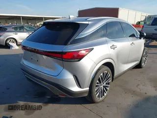 2023 Lexus RX with VIN JTJCHMAA6P2000651, listed as a IAAI auction lot 40700931 with 6,576 mi miles. Bid and sale history available at carsss.com. Image 4.