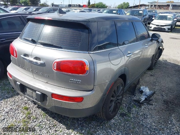 2016 MINI Cooper Clubman with VIN WMWLN5C56G2E30309, listed as a IAAI auction lot 41772501 with 67,584 mi miles. Bid and sale history available at carsss.com. Image 4.