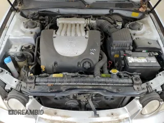 2005 Kia Optima LX z VIN KNAGD128155423463, wystawiony jako Copart lot #87441284 z przebiegiem 143 193 mil mil oraz Szkoda całkowita • Salvage title. Historia ofert i sprzedaży dostępna na DreamBid. Obrazek 12.