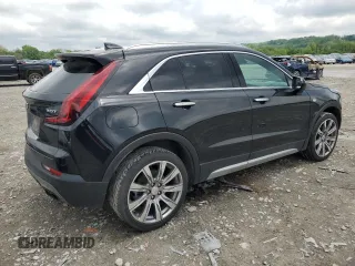 2019 Cadillac XT4 FWD Premium Luxury z VIN 1GYFZCR49KF147242, wystawiony jako Copart lot #55483215 z przebiegiem 94 990 mil mil oraz Szkody całkowita. Historia ofert i sprzedaży dostępna na DreamBid. Obrazek 3.