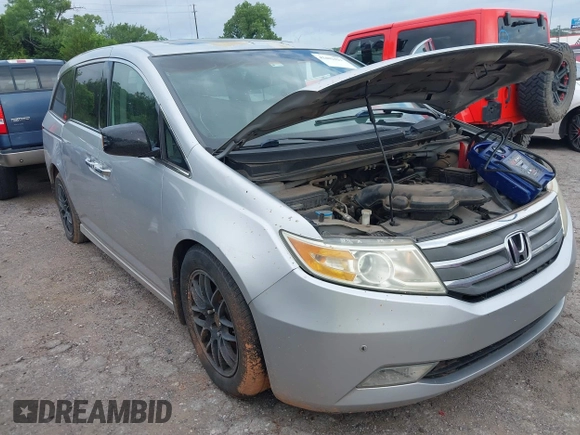 2011 Honda Odyssey Touring with VIN 5FNRL5H93BB071518, listed as a IAAI auction lot 42402421 with 227,647 mi miles and . Bid and sale history available at DreamBid. Image 1.