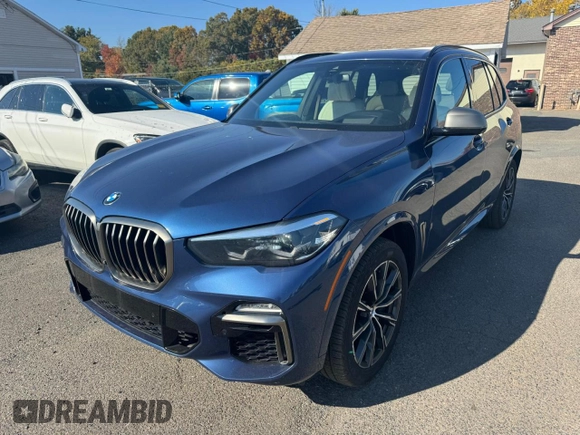 2021 BMW X5 M50i with VIN 5UXJU4C00M9H36466, listed as a Copart auction lot 77444344 with 100,119 mi miles and Clean Title. Bid and sale history available at carsss.com. Image 1.