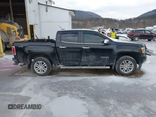 2015 GMC Canyon 4WD SLT with VIN 1GTG6CE39F1202730, listed as a IAAI auction lot 41510275 with 114,444 mi miles. Bid and sale history available at carsss.com. Image 14.