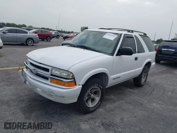 2003 Chevrolet Blazer Xtreme z VIN 1GNCS18X33K152868, wystawiony jako IAAI lot #39801584 z przebiegiem 167 157 mil mil oraz . Historia ofert i sprzedaży dostępna na DreamBid. Obrazek 2.