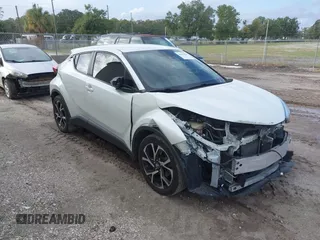 2018 Toyota C-HR XLE with VIN JTNKHMBX3J1010211, listed as a IAAI auction lot 40799443 with 104,148 mi miles. Bid and sale history available at carsss.com. Image 1.