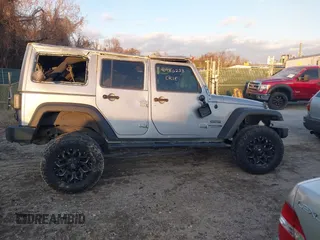 2018 Jeep Wrangler JK Unlimited Sport S with VIN 1C4BJWDG5JL862100, listed as a IAAI auction lot 40986228 with 1 mi miles. Bid and sale history available at carsss.com. Image 14.
