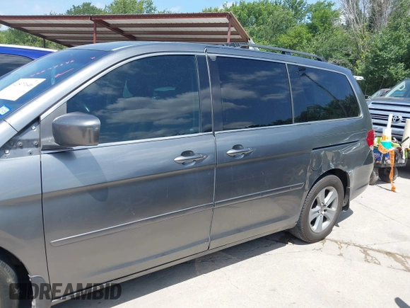 2010 Honda Odyssey Touring with VIN 5FNRL3H90AB053710, listed as a IAAI auction lot 42577646 with 255,351 mi miles and . Bid and sale history available at DreamBid. Image 6.