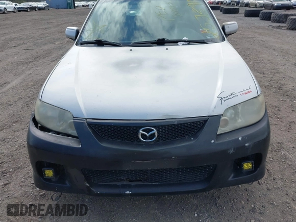 2002 Mazda Protege with VIN JM1BJ245921455563, listed as a IAAI auction lot 42064853 with Not Provided miles and . Bid and sale history available at DreamBid. Image 6.