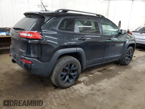 2015 Jeep Cherokee Trailhawk z VIN 1C4PJMBS0FW598694, wystawiony jako Copart lot #60731615 z przebiegiem 130 219 mil mil oraz Czysty tytuł • Clean title. Historia ofert i sprzedaży dostępna na DreamBid. Obrazek 3.