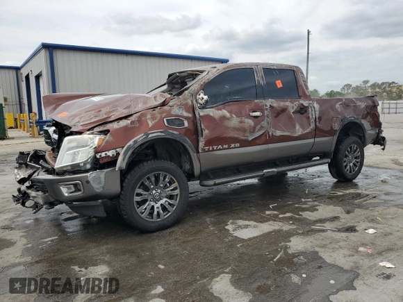 2016 Nissan Titan Platinum Reserve z VIN 1N6BA1F28GN506397, wystawiony jako Copart lot #53831235 z przebiegiem 258 474 mil mil oraz Nie do naprawy • Non repairable. Historia ofert i sprzedaży dostępna na DreamBid. Obrazek 1.