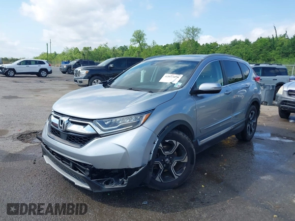 2018 Honda CR-V Touring with VIN 7FARW1H90JE012526, listed as a IAAI auction lot 42055078 with 96,098 mi miles and . Bid and sale history available at DreamBid. Image 17.