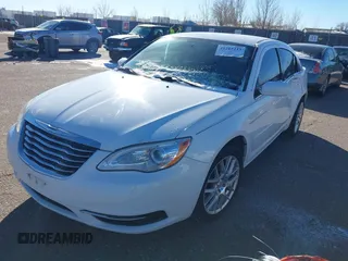 2012 Chrysler 200 LX with VIN 1C3CCBAB4CN317548, listed as a IAAI auction lot 41215213 with 140,497 mi miles. Bid and sale history available at carsss.com. Image 2.