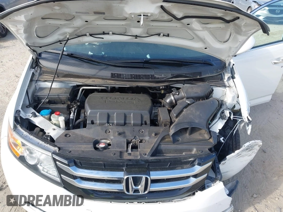 2016 Honda Odyssey EX-L z VIN 5FNRL5H60GB011001, wystawiony jako IAAI lot #41897958 z przebiegiem 126 133 mil mil oraz . Historia ofert i sprzedaży dostępna na DreamBid. Obrazek 10.