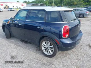 2013 MINI Countryman with VIN WMWZB3C5XDWM31035, listed as a IAAI auction lot 42543943 with 151,209 mi miles and . Bid and sale history available at DreamBid. Image 3.