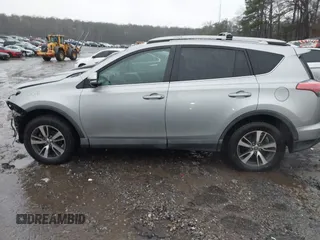 2018 Toyota RAV4 XLE with VIN 2T3RFREV2JW717351, listed as a IAAI auction lot 41576522 with 147,116 mi miles. Bid and sale history available at carsss.com. Image 14.