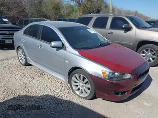 2014 Mitsubishi Lancer ES z VIN JA32U2FU5EU010542, wystawiony jako IAAI lot #41834895 z przebiegiem 215 710 mil mil oraz . Historia ofert i sprzedaży dostępna na DreamBid. Obrazek 1.