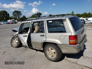 1994 Jeep Grand Cherokee Laredo z VIN 1J4GZ58S5RC328902, wystawiony jako Copart lot #70150474 z przebiegiem 195 604 mil mil oraz Szkoda całkowita • Salvage title. Historia ofert i sprzedaży dostępna na DreamBid. Obrazek 2.