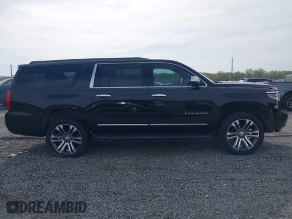 2019 Chevrolet Suburban LT with VIN 1GNSCHKC2KR408575, listed as a IAAI auction lot 42060103 with 144,838 mi miles and . Bid and sale history available at DreamBid. Image 13.