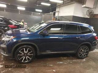 2022 Honda Pilot Touring 7-Passenger with VIN 5FNYF6H65NB052164, listed as a IAAI auction lot 41641601 with 51,700 mi miles. Bid and sale history available at carsss.com. Image 14.