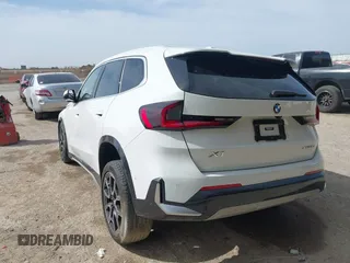2023 BMW X1 xDrive28i with VIN WBX73EF07P5W32455, listed as a IAAI auction lot 41825701 with 12,453 mi miles and . Bid and sale history available at DreamBid. Image 3.