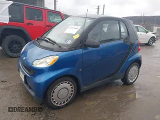 2009 Smart fortwo Pure with VIN WMEEJ31X69K312553, listed as a IAAI auction lot 41957660 with 156,476 mi miles. Bid and sale history available at carsss.com. Image 2.