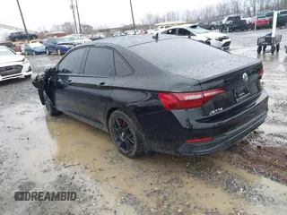 2023 Volkswagen Jetta Sport z VIN 3VWBM7BU2PM028974, wystawiony jako IAAI lot #41547698 z przebiegiem 30 061 mil mil oraz . Historia ofert i sprzedaży dostępna na DreamBid. Obrazek 3.