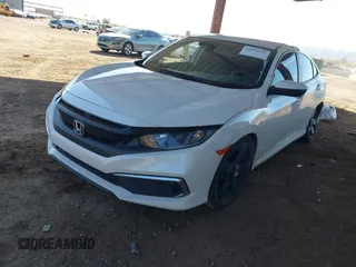 2020 Honda Civic LX with VIN 19XFC2F66LE007328, listed as a IAAI auction lot 41852111 with 135,956 mi miles and . Bid and sale history available at DreamBid. Image 2.