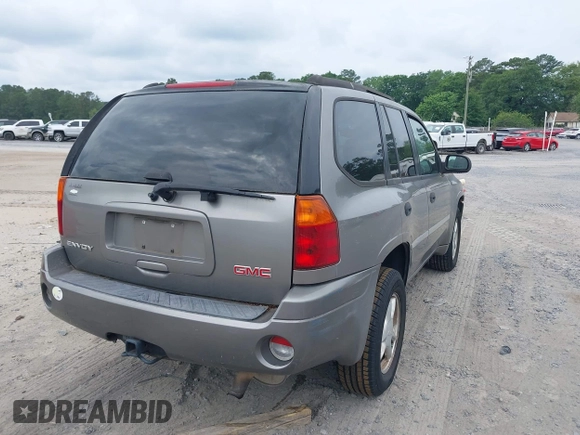 2007 GMC Envoy SLE with VIN 1GKDS13S572174308, listed as a IAAI auction lot 42211372 with 212,377 mi miles and . Bid and sale history available at DreamBid. Image 4.