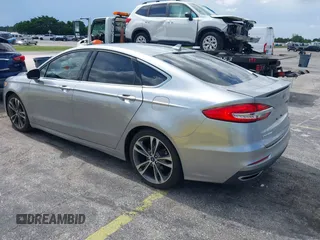 2020 Ford Fusion Titanium with VIN 3FA6P0D95LR199443, listed as a IAAI auction lot 42721371 with 77,592 mi miles and . Bid and sale history available at DreamBid. Image 3.