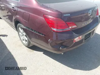 2007 Toyota Avalon XL z VIN 4T1BK36B97U205988, wystawiony jako IAAI lot #41738847 z przebiegiem 99 951 mil mil oraz . Historia ofert i sprzedaży dostępna na DreamBid. Obrazek 6.