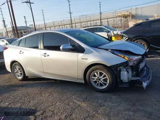2019 Toyota Prius L Eco with VIN JTDKARFU2K3082593, listed as a IAAI auction lot 41657698 with 239,412 mi miles. Bid and sale history available at carsss.com. Image 13.