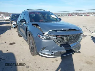 2022 Mazda CX-9 Grand Touring with VIN JM3TCBDYXN0625567, listed as a IAAI auction lot 41327380 with 50,672 mi miles and . Bid and sale history available at DreamBid. Image 1.