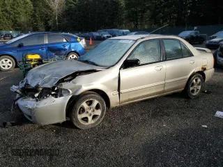 2002 Mazda Protege DX with VIN JM1BJ225820539396, listed as a Copart auction lot 89315515 with 169,012 mi miles and Salvage Title. Bid and sale history available at DreamBid. Image 1.