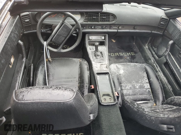 1987 Porsche 944 z VIN WP0AB0946HN474232, wystawiony jako Copart lot #64654684 z przebiegiem 87 126 mil mil oraz Szkoda całkowita • Salvage title. Historia ofert i sprzedaży dostępna na DreamBid. Obrazek 8.