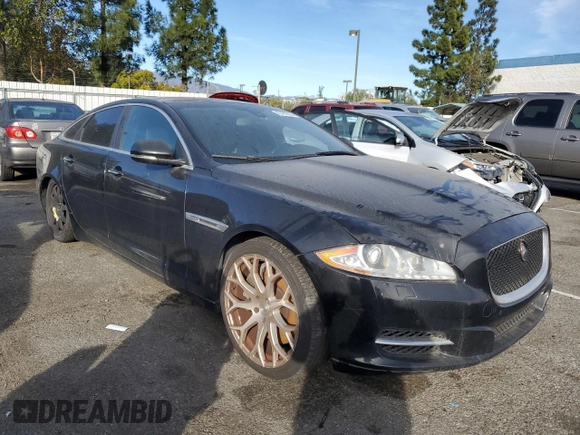 2015 Jaguar XJ with VIN SAJWA3HT2FMV89272, listed as a Copart auction lot 42195005 with 131,456 mi miles and Clean Title. Bid and sale history available at DreamBid. Image 4.