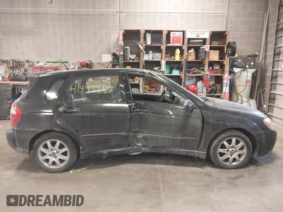 2005 Kia Spectra with VIN KNAFE161255083357, listed as a IAAI auction lot 41445285 with 90,349 mi miles. Bid and sale history available at carsss.com. Image 14.