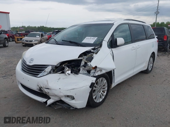 2011 Toyota Sienna XLE AAS with VIN 5TDYK3DC3BS161414, listed as a IAAI auction lot 41124705 with 167,364 mi miles. Bid and sale history available at carsss.com. Image 2.