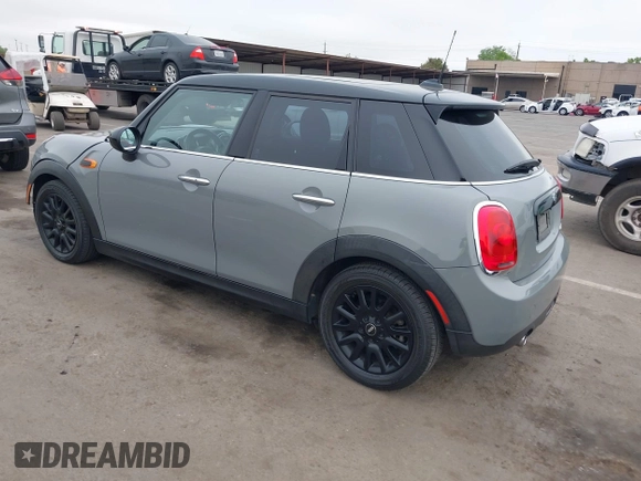 2015 MINI Hardtop 4 Door with VIN WMWXS5C52FT829699, listed as a IAAI auction lot 42078187 with 59,641 mi miles and . Bid and sale history available at DreamBid. Image 3.