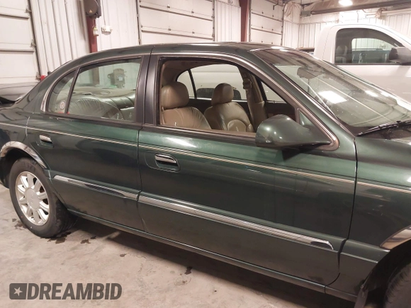 2001 Lincoln Continental with VIN 1LNHM97V11Y691910, listed as a IAAI auction lot 41501779 with 102,715 mi miles and . Bid and sale history available at DreamBid. Image 13.