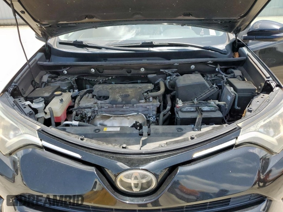 2018 Toyota RAV4 XLE with VIN 2T3WFREV2JW433186, listed as a Copart auction lot 61008705 with 57,310 mi miles and Salvage title. Bid and sale history available at DreamBid. Image 12.