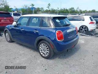 2015 MINI Hardtop 4 Door with VIN WMWXS5C51FT827510, listed as a IAAI auction lot 42365599 with 53,667 mi miles and . Bid and sale history available at DreamBid. Image 3.