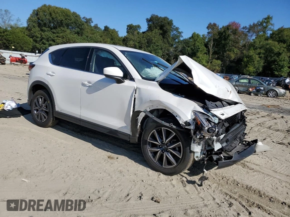 2018 Mazda CX-5 Grand Touring with VIN JM3KFADM9J1439436, listed as a Copart auction lot 74189114 with 0 mi miles and Salvage Title. Bid and sale history available at carsss.com. Image 4.