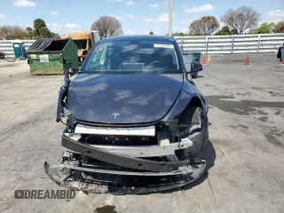 2025 Tesla Model Y Long Range with VIN 7SAYGDED8SF241779, listed as a Copart auction lot 51899205 with 12,409 mi miles and Salvage Title. Bid and sale history available at DreamBid. Image 5.