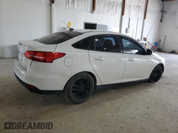 2016 Ford Focus SE z VIN 1FADP3F26GL404670, wystawiony jako Copart lot #52876095 z przebiegiem 80 425 mil mil oraz Szkoda całkowita • Salvage title. Historia ofert i sprzedaży dostępna na DreamBid. Obrazek 3.