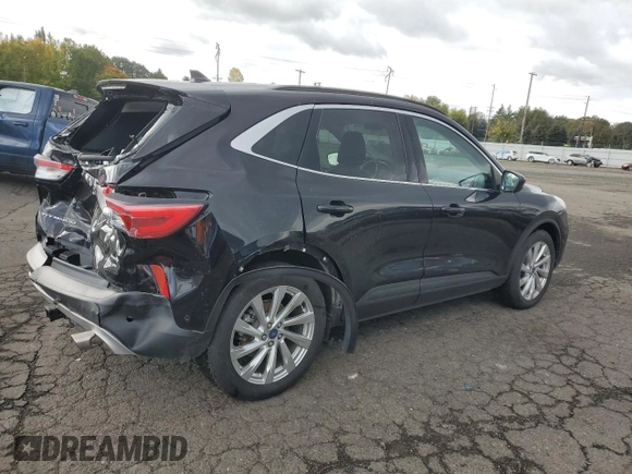 2021 Ford Escape Titanium with VIN 1FMCU9J98MUA73257, listed as a Copart auction lot 74838394 with 41,294 mi miles and Salvage Title. Bid and sale history available at carsss.com. Image 3.