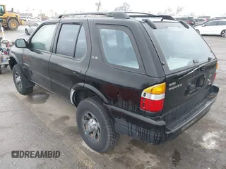 1998 Isuzu Rodeo S z VIN 4S2CM58W6W4336183, wystawiony jako IAAI lot #41874570 z przebiegiem 162 097 mil mil oraz . Historia ofert i sprzedaży dostępna na DreamBid. Obrazek 3.
