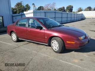 2001 Saturn SL z VIN 1G8ZK54731Z305098, wystawiony jako Copart lot #83875424 z przebiegiem 82 879 mil mil oraz Tytuł czysty. Historia ofert i sprzedaży dostępna na DreamBid. Obrazek 4.