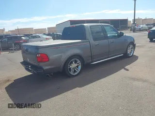 2002 Ford F-150 Harley Davidson with VIN 1FTRW07312KC88379, listed as a IAAI auction lot 41657219 with 1 mi miles. Bid and sale history available at carsss.com. Image 4.
