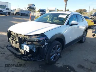 2023 Mazda CX-30 2.5 S Premium Package with VIN 3MVDMBDM4PM520769, listed as a IAAI auction lot 41371190 with 15,626 mi miles. Bid and sale history available at carsss.com. Image 2.
