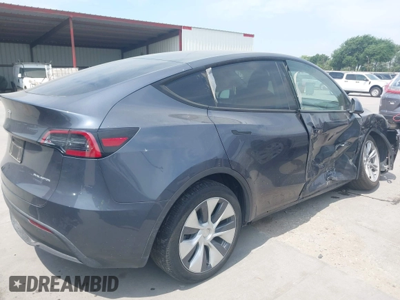 2023 Tesla Model Y Long Range z VIN 7SAYGDEE6PA169168, wystawiony jako IAAI lot #42050428 z przebiegiem 26 731 mil mil oraz . Historia ofert i sprzedaży dostępna na DreamBid. Obrazek 4.